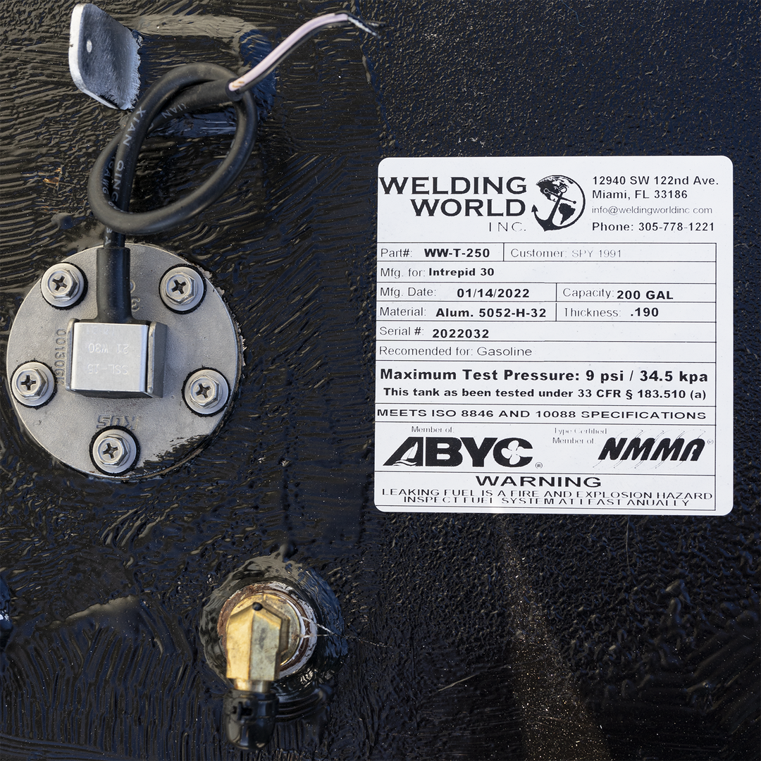 Certification label for the 200-gallon aluminum bow fuel tank installed in the Intrepid 30' center console. Issued by Welding World Inc. (Part #WW-T-250, Serial #2022032), the label confirms construction from .190″ 5052-H32 marine-grade aluminum, rated for gasoline containment. It documents a manufacturing date of 01/14/2022 and specifies a maximum pressure rating of 9 psi under 33 CFR § 183.510(a). The tank meets ISO 8846 and 10088 standards and bears compliance with ABYC and NMMA