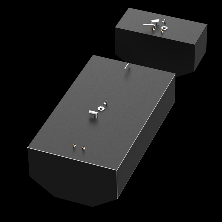 Two dark gray, rectangular fuel tanks, of different sizes, are shown against a black background. Both tanks have various metallic fittings on their top surfaces, and a thin white outline along their top edges