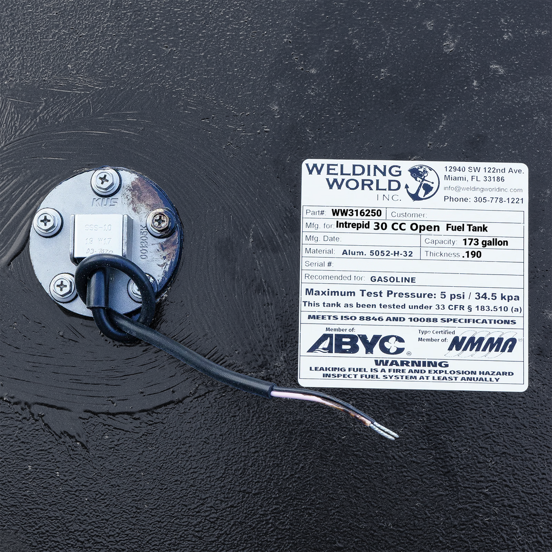 A crisp, close-up top-down view of the official manufacturer specification data placard and certification label from file image_431463.jpg, permanently affixed to a black encapsulated Intrepid 30 CC Open replacement marine fuel tank. The white, weather-resistant technical ID tag prominently displays the Welding World Inc. logo and Miami, FL contact information alongside critical engineering metrics, including Part # WW316250, a total capacity of 173 gallons, and heavy-duty structural composition of marine-g