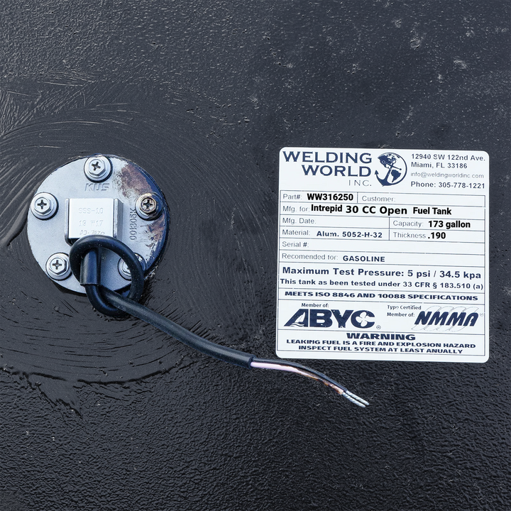 A crisp, close-up top-down view of the official manufacturer specification data placard and certification label from file image_431463.jpg, permanently affixed to a black encapsulated Intrepid 30 CC Open replacement marine fuel tank. The white, weather-resistant technical ID tag prominently displays the Welding World Inc. logo and Miami, FL contact information alongside critical engineering metrics, including Part # WW316250, a total capacity of 173 gallons, and heavy-duty structural composition of marine-g