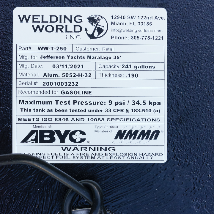 A close-up of a product label for a fuel tank manufactured by Welding World Inc., detailing specifications like part number WW-T-250, capacity 241 gallons, material, manufacturing date, and safety warnings