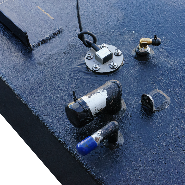 Close-up view of a Key Largo 21' OEM replacement belly fuel tank with an 84-gallon capacity, featuring various fittings and connections on its surface