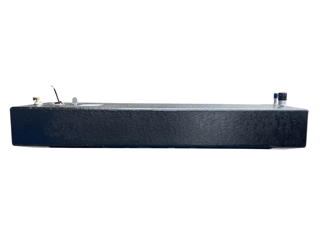 A long side profile photo of a dark, textured boat fuel tank, showing various fittings on its top surface, against a transparent checkerboard background.