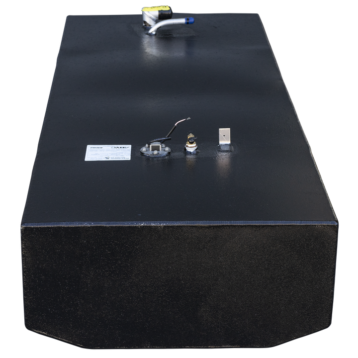 A frontal view of a long, rectangular boat fuel tank with a textured black finish, shown against a checkered background. The front bottom edge is cut with two angles to form a shallow V-shape. On the top surface in the foreground, there is a fuel sending unit on a round base, a brass fitting, a small vertical tab, and a white label. At the far end of the tank, a second fuel fitting assembly with a yellow top is visible