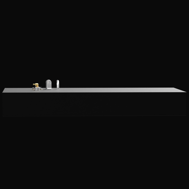 A rectangular black fuel tank with metal fittings and pipes on top, including a brass valve, set against a black background
