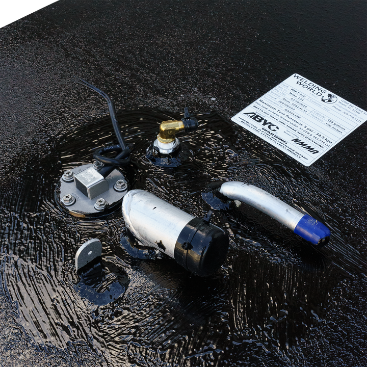 Close-up view of a 1984 Mako 224 OEM replacement fuel tank, featuring fuel fittings and a fuel gauge, with a textured black surface