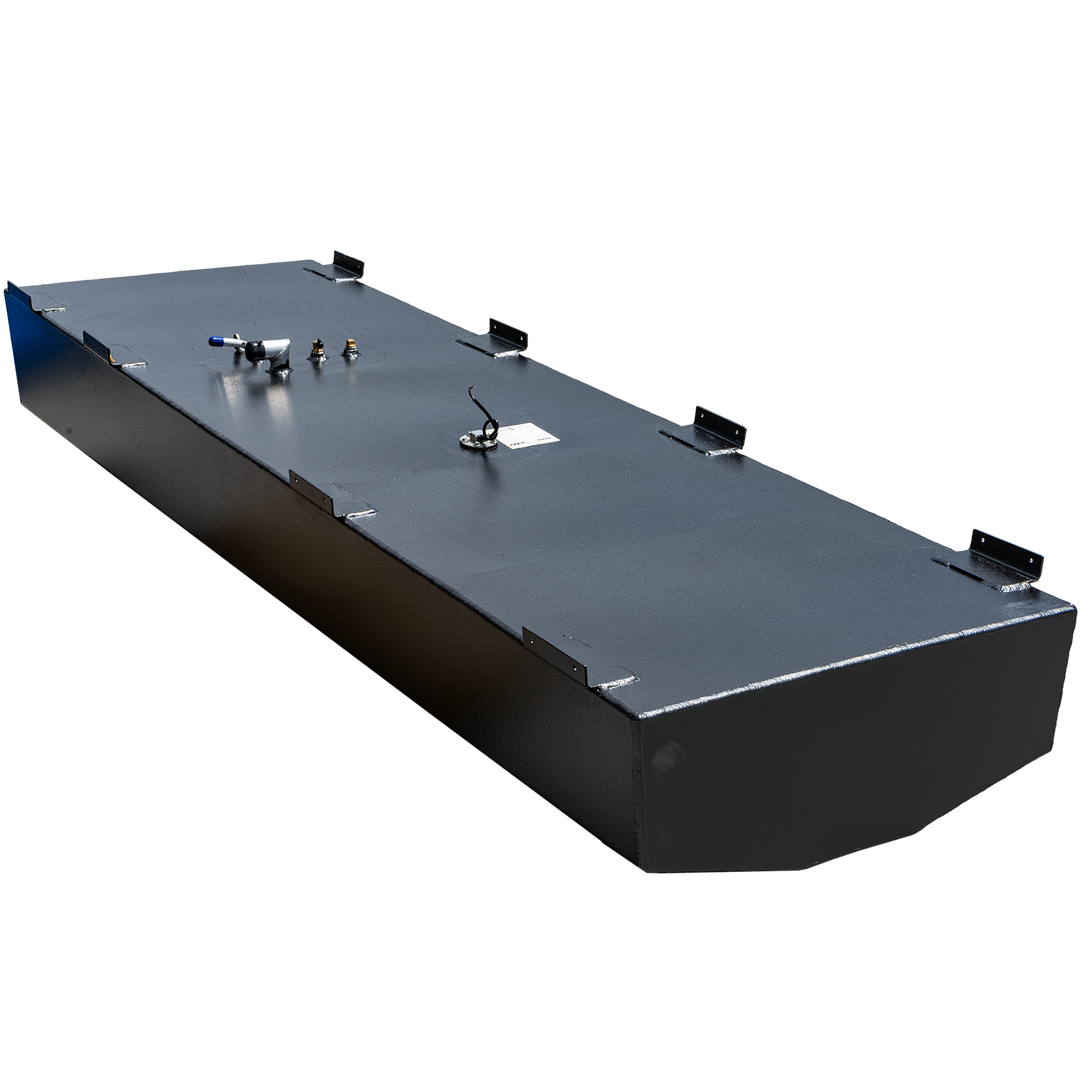 A long, black, rectangular fuel tank with a textured surface and multiple metal brackets along its top edges. Various fittings are visible on the top surface, including a fuel sender with wiring, a small brass fitting, and an L-shaped hose connection with a blue cap. The front end of the tank is rounded