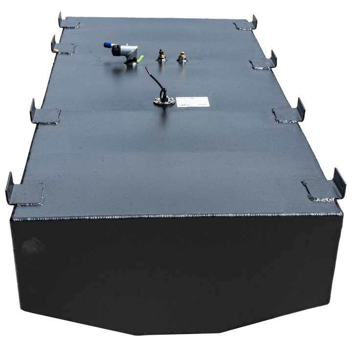 A black, rectangular fuel tank with a textured surface and multiple metal brackets along its top edges. Various fittings are visible on the top surface, including a fuel sender with wiring, a small brass fitting, and an L-shaped hose connection with a blue cap. The front and back ends of the tank are rounded with faceted corners