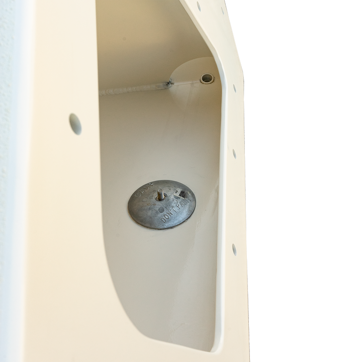 Close-up view of a high flotation bracket from a 1987 Mako 258 Cuddy twin engine boat, featuring a circular metal plate with three screws inside a white fiberglass structure