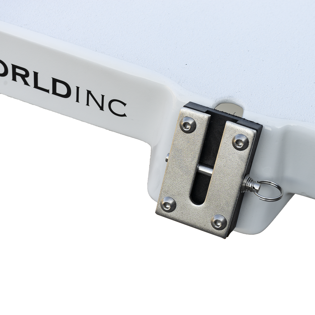 Close-up of a white marine flotation bracket with a metal locking latch and mounting hardware, attached to a white surface. The bracket is part of a boat's engine support system, designed for a Mako 261 1990 model