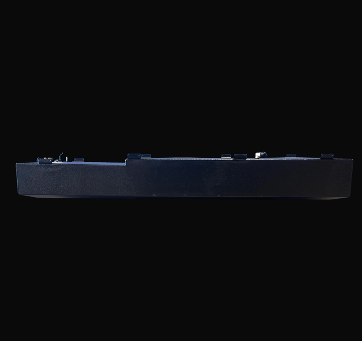 Side elevation view of the 1998 Mako 261 replacement fuel tank (171 gal), capturing the full longitudinal profile. The image displays the stepped top deck design, distinct welded mounting tabs along the upper edge, and black-coated aluminum construction.