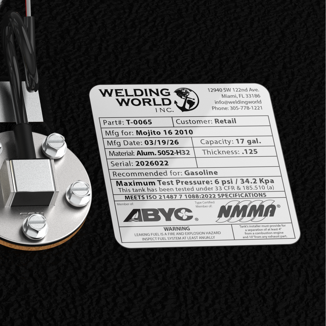 Detail view of the Mojito 16 (2010) fuel tank top fittings, including the 1.5-inch fill, .375-inch pickup, and pre-installed WEMA sender port. The uniform Coal Tar Epoxy coating protects the precision TIG welds, ensuring this 17-gallon OEM replacement fits perfectly under the deck as specified in CAD #12435-1.