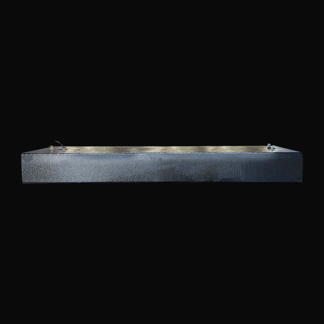 An eye-level studio side profile view displaying the slim 8-inch depth and full 96-inch length of a physical, finished black encapsulated Paramount 21 2025 OEM replacement marine fuel tank (84 gal) from file image_c20c48.png, isolated against a black background. Precision-fabricated from heavy-gauge .190" marine-grade 5052-H32 aluminum, the elongated rectangular body is fully encapsulated in a protective, textured black TarGard epoxy coating to resist severe saltwater pitting and bilge moisture decay. Visib