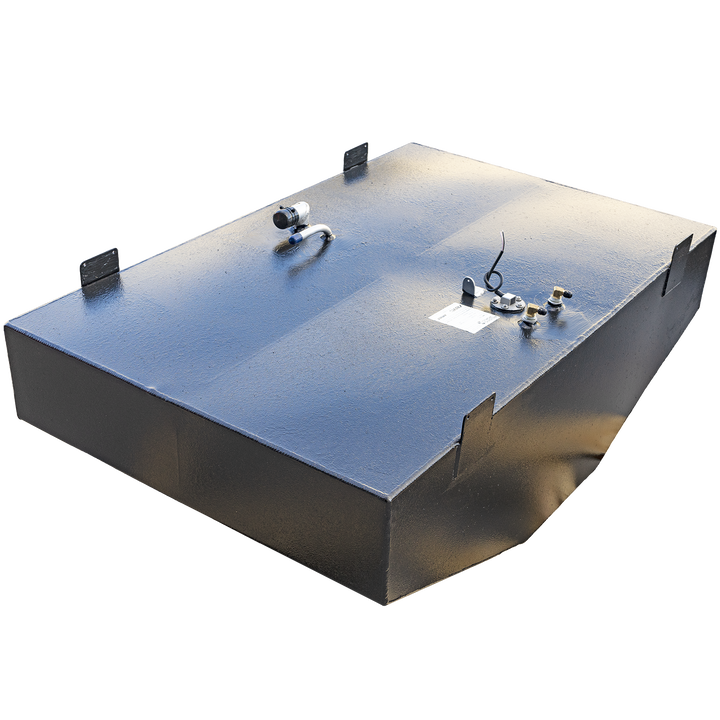 A rectangular, black fuel tank with a textured surface is positioned at an angle against a black and grey checkerboard background. Its top surface features various metal fittings, including a brass valve, a white label, a circular gauge, and an L-shaped hose connection. Black, rectangular mounting brackets are visible along the top edges of the tank. The tank's front left corner is visible