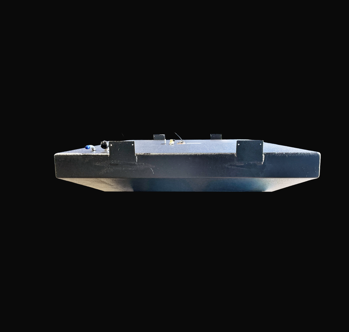 A straight side-elevation profile view of a black Parker 23 replacement marine fuel tank from file image_97f684.png, isolated against a black background. This longitudinal perspective highlights the alternative side view of the wide, low-profile 140-gallon center-hull fuel cell, showcasing the heavy-duty welded aluminum mounting brackets with pre-drilled anchoring holes along the side walls. Precision-fabricated from heavy-gauge marine-grade 5052-H32 aluminum, the structural tank body is completely encapsul