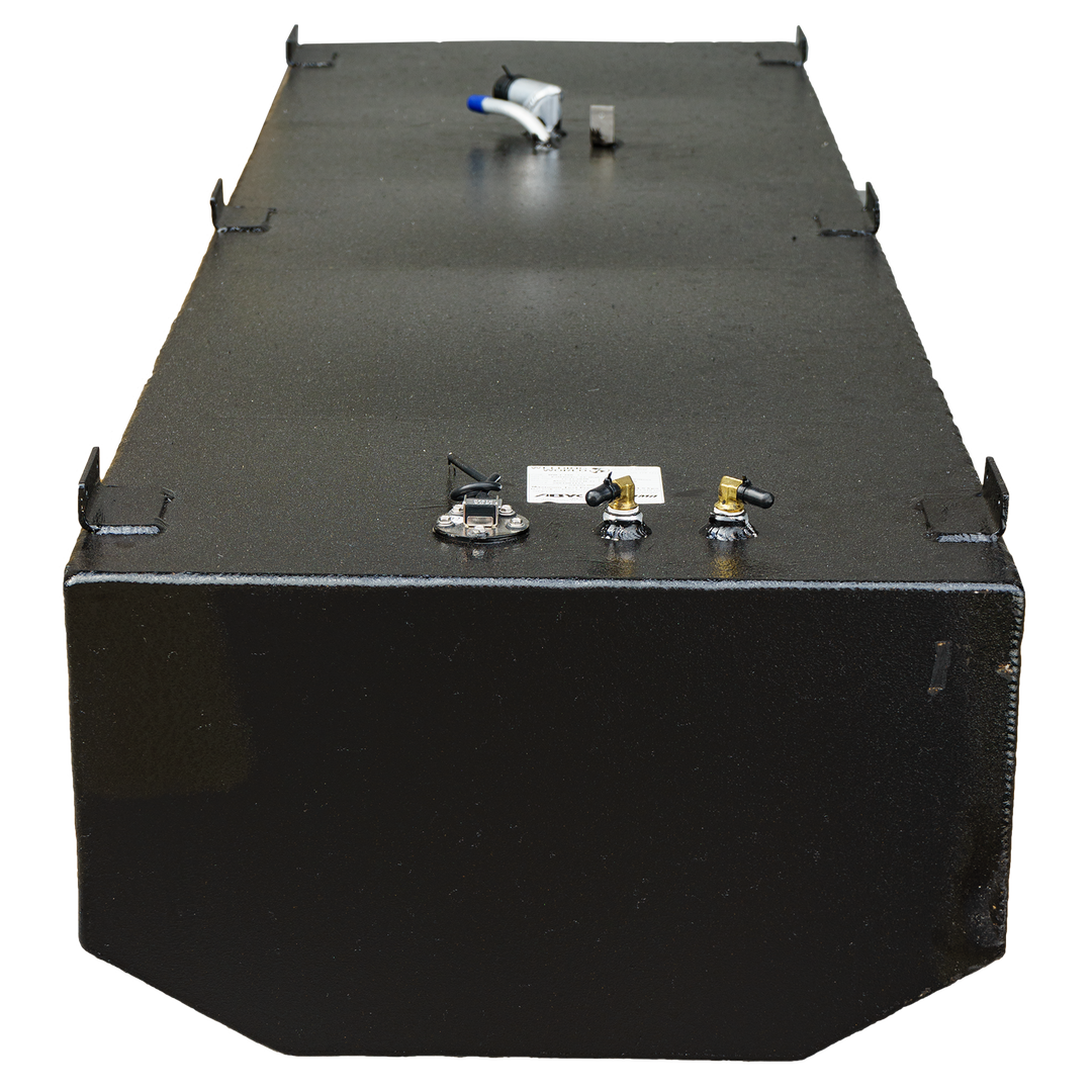 A close-up elevated view of a dark rectangular fuel tank, featuring multiple ports, including a fuel gauge and connection points, with a black textured surface and a label attached. The image shows the tank's flat top and distinct edges against a transparent background