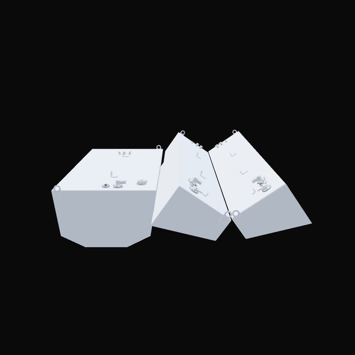 Three light-grey, untextured 3D models of boat fuel tanks are arranged against a black background. One larger, hexagonal-shaped tank is on the left, with various fittings on its top surface. To its right, two smaller, elongated, and similarly shaped tanks are positioned at an angle, also featuring fittings on their tops. The models appear to be a digital representation of the physical tanks