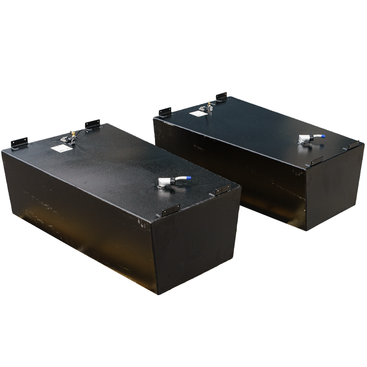 A pair of black, textured, rectangular fuel tanks, shown from an elevated perspective. Each tank features metal brackets on the corners of its top surface and several cylindrical fittings, one with a blue cap, protruding from the top. The background is a black and grey checkerboard pattern