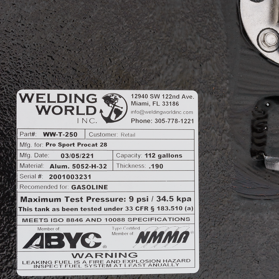 A close-up of a white product label for a fuel tank from Welding World Inc. The label displays details such as Part# WW-T-250, manufactured for Pro Sport Procat 28, manufacturing date 03/05/2021, capacity 112 gallons, material Alum. 5052-H-32, thickness .190, serial # 2001003231, recommended for gasoline, maximum test pressure 9 psi / 34.5 kPa, and states that it meets ISO 8846 and 10088 specifications. It also indicates membership with ABYC and NMMA, and includes a warning about leaking fuel