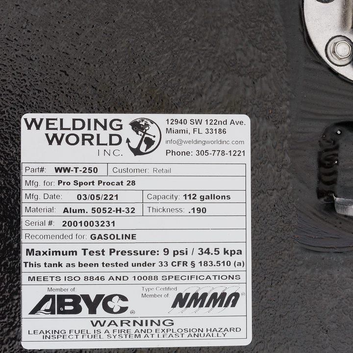 A close-up of a white product label for a fuel tank from Welding World Inc. The label displays details such as Part# WW-T-250, manufactured for Pro Sport Procat 28, manufacturing date 03/05/2021, capacity 112 gallons, material Alum. 5052-H-32, thickness .190, serial # 2001003231, recommended for gasoline, maximum test pressure 9 psi / 34.5 kPa, and states that it meets ISO 8846 and 10088 specifications. It also indicates membership with ABYC and NMMA, and includes a warning about leaking fuel