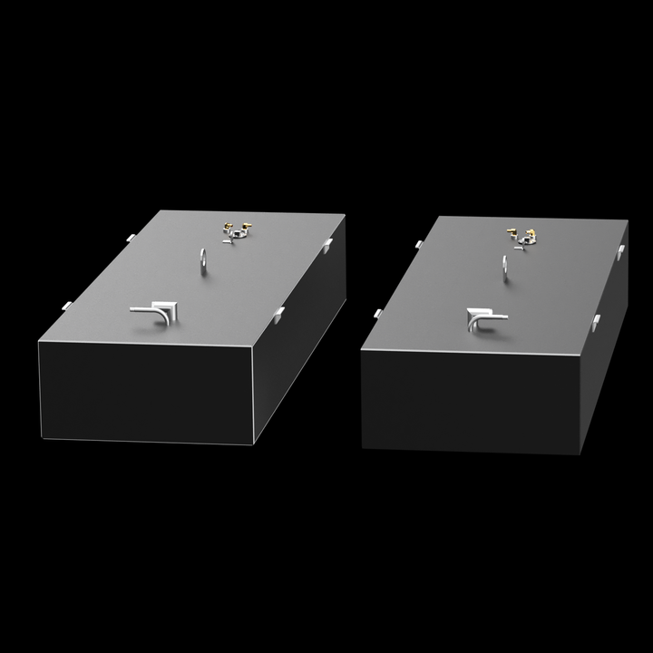 Two dark grey, rectangular fuel tanks, each featuring various golden and silver-colored fittings on their top surfaces, including pipes, valves, and a large D-ring. Small white rectangular brackets are visible along the edges of the top surfaces. The tanks are positioned at an angle against a black background with subtle white dots