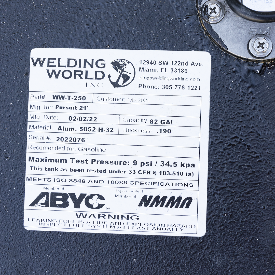 Manufacturer label for 82-gallon aluminum fuel tank fabricated by Welding World Inc. for the 1993 Pursuit 21. Identified as Part #WW-T-250 with Serial #2022076, the tank is constructed from .190″ thick 5052-H-32 marine-grade aluminum and designated for gasoline use. Maximum test pressure rated at 9 psi per 33 CFR § 183.510(a). Label confirms ISO 8846 and 10088 compliance, ABYC and NMMA membership, and includes safety notice for annual fuel system inspections