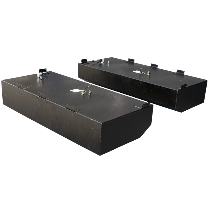 Two black, rectangular Pursuit 2879 WA 2001 OEM Replacement Saddle Fuel Tanks are shown, each with slightly different features. The tank in the foreground has a rounded front edge, while the one in the background is fully rectangular. Both tanks have several fittings and connection points on their top surfaces, and metal brackets are attached to their top edges