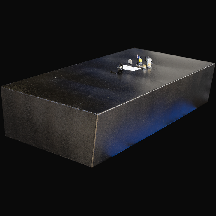 Black rectangular fuel tank with a rough textured surface, viewed from a front-right angle. The tank has welded seams along its edges and several fittings, valves, and a label mounted on the top surface. The label is white with black text and appears to have product and manufacturing details. The tank is identified as a Robalo 2320 1993 model, with a 116-gallon capacity, designed as an OEM replacement belly fuel tank