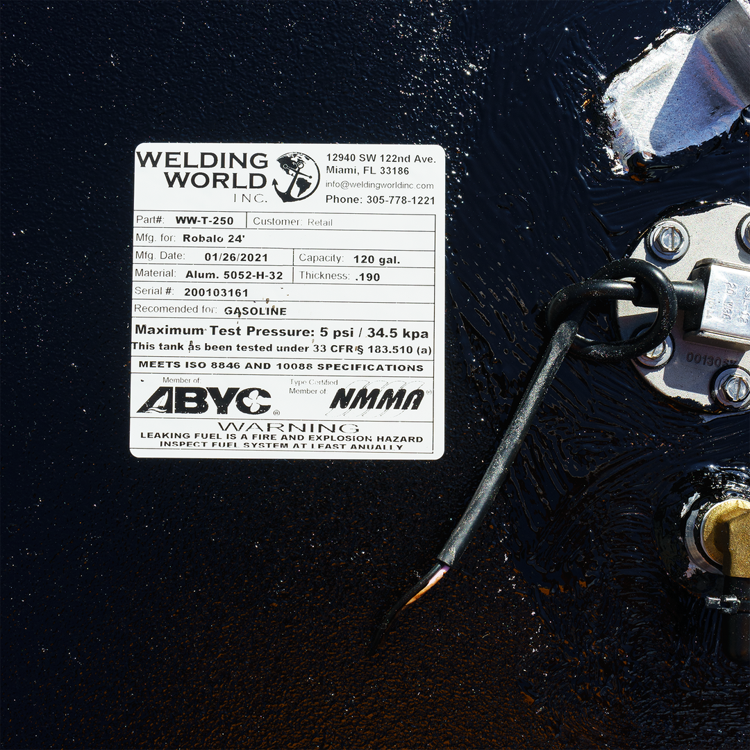 Label on a 120-gallon OEM replacement fuel tank for a Robalo 24' boat, manufactured by Welding World Inc. The label includes details such as part number, manufacturing date, materials, maximum test pressure, and safety warnings regarding fuel leakage
