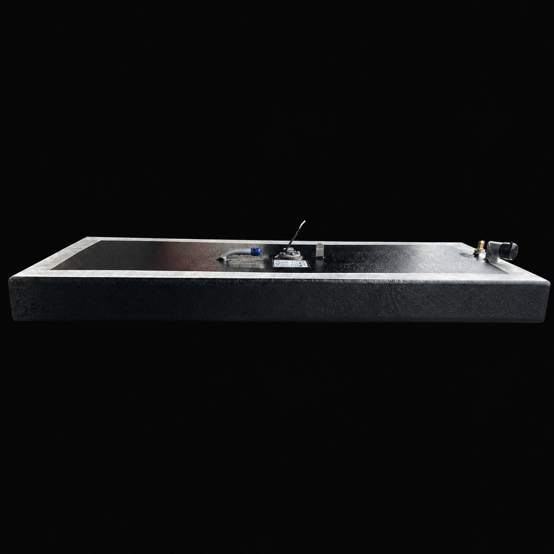 A full side-elevation perspective view of a low-profile rectangular black Scout 16 replacement marine fuel tank. This 32-gallon capacity center-hull fuel cell is precision-fabricated by Welding World from heavy-gauge marine-grade 5052-H32 aluminum, showcasing a slim 7" depth designed to fit within tight factory bilge compartments. The structure features a semi-encapsulated design with a protective, textured black TarGard epoxy finish across the main surfaces while revealing a clean silver raw aluminum borde