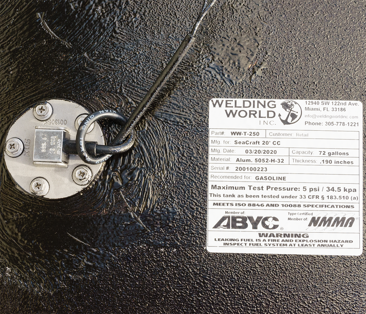 Close-up of a 1978 SeaCraft 20' OEM replacement fuel tank featuring a fuel fill cap and a label from Welding World, Inc. The label includes details such as the model number (WW-T-250), customer number, capacity (72 gallons), and maximum test pressure (5 psi / 34.5 kPa), along with a warning about gasoline and compliance with ABYC and NMMA specifications