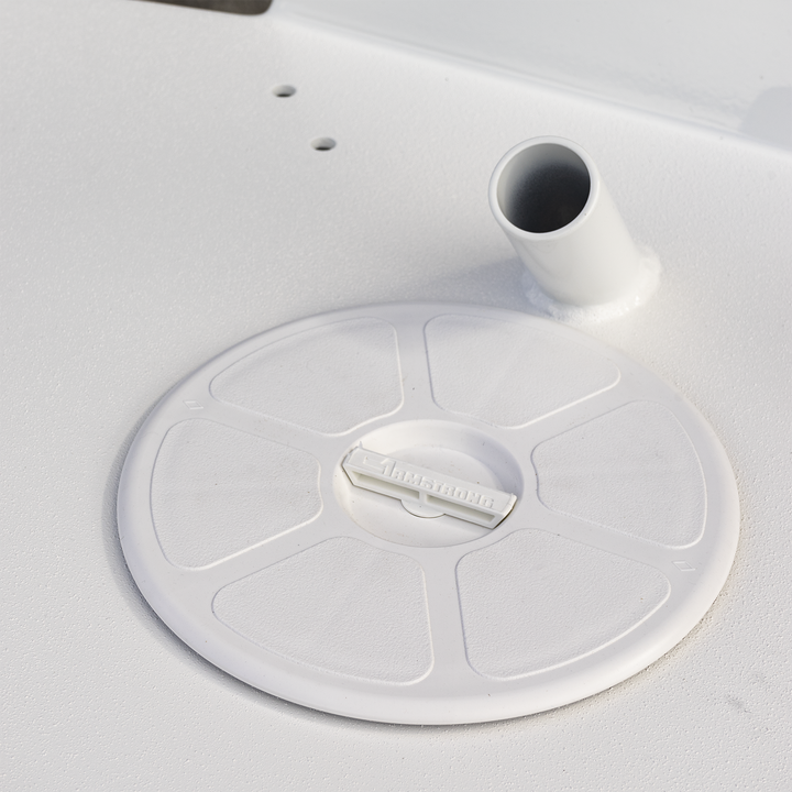 A close-up view of a Seacraft 23 Twin Engine High Flotation Bracket, featuring a circular base with three mounting holes and a central opening, designed for enhanced stability and support for twin engines on a boat. The image is predominantly bright, with a white background