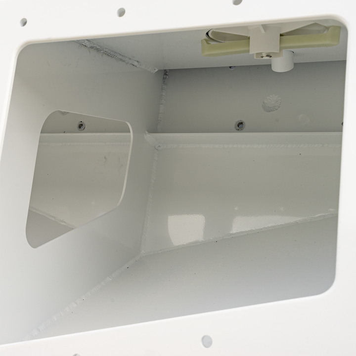 Close-up view of the interior of a Seacraft 23 twin engine high flotation bracket, showcasing the white structural design and a mounted fan or ventilation component