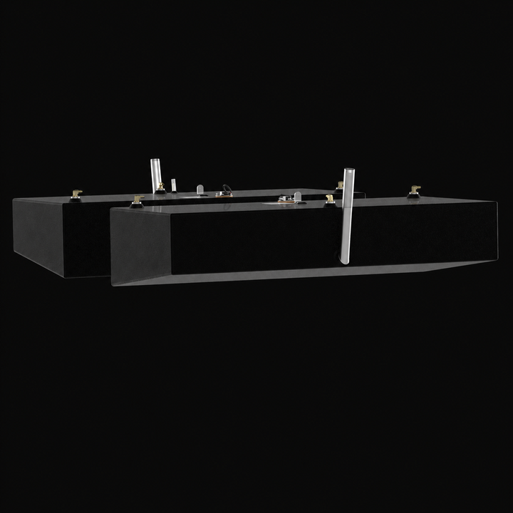 A low-angle side-elevation profile view of a pair of black Shamrock 25-9 Saddle (2-tank combo) replacement marine fuel tanks from file image_734b54.jpg, isolated against a black background. This staggered port and starboard matching pair highlights the long, shallow rectangular profile of the 52-gallon outboard fuel cells, displaying a distinct longitudinal bottom-edge bevel engineered by Welding World to conform perfectly to the vessel's outer deadrise and sit securely within the side hull cavities. Precis