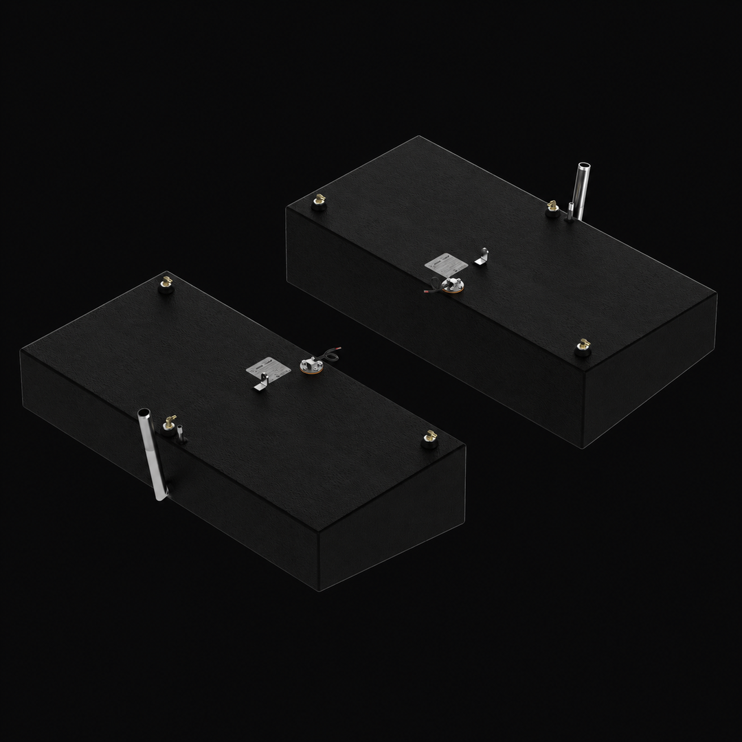 A high-angle isometric perspective view of a pair of black Shamrock 25-9 Saddle (2-tank combo) replacement marine fuel tanks from file image_7351de.jpg, isolated against a black background. This alternative top-down angle showcases the mirrored port and starboard 52-gallon outboard fuel cells arranged parallel to one another. Precision-fabricated from heavy-gauge marine-grade 5052-H32 aluminum, the structural tanks are fully encapsulated in a protective, textured black TarGard epoxy coating to resist harsh 