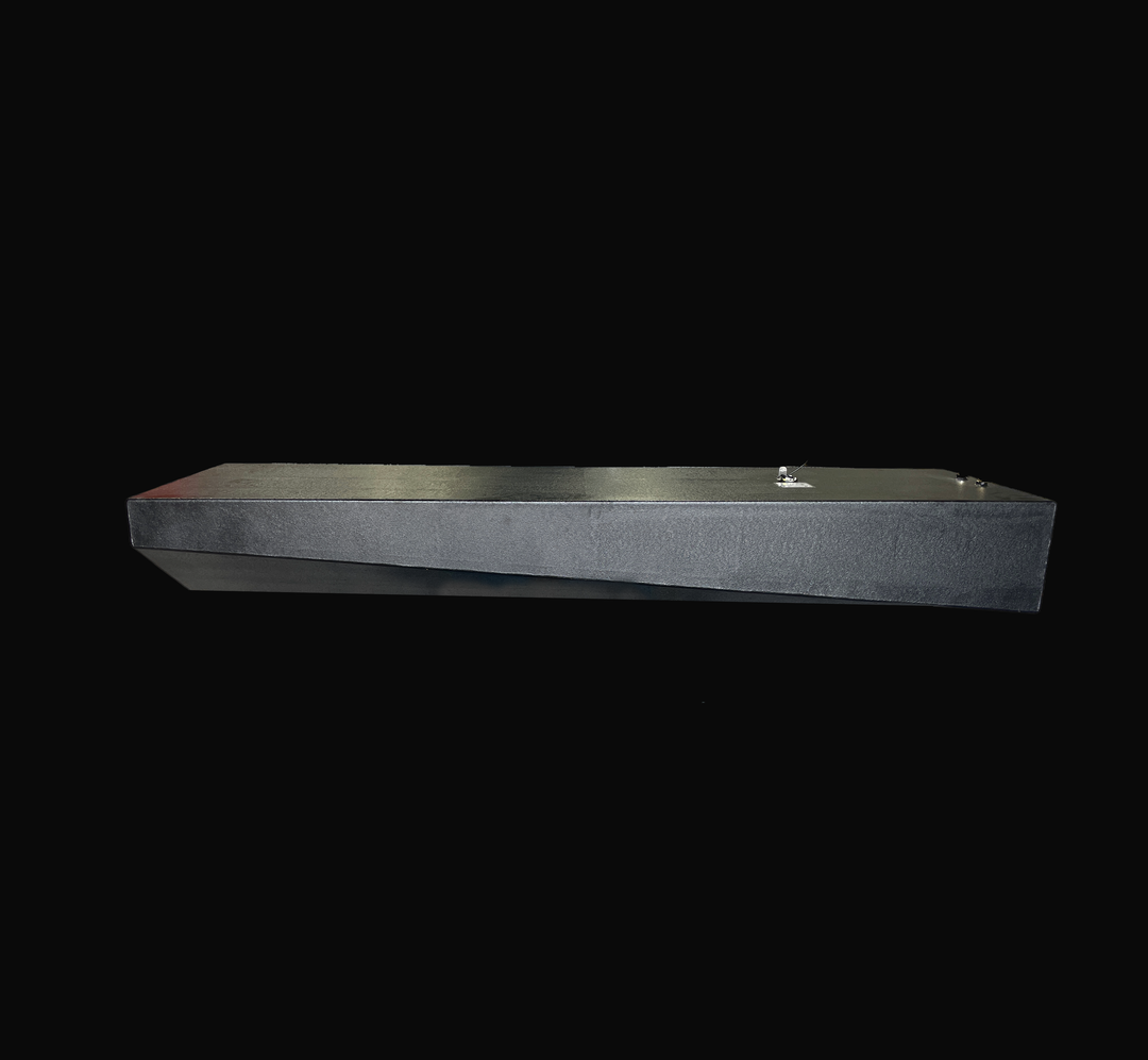 Side-elevation view of a Sonic 31 replacement fuel tank showcasing its specialized tapered hull-conforming geometry and rugged black Coal Tar Epoxy coating. Built from heavy-duty .190" marine-grade aluminum, this tank features precision 316 stainless steel fuel fittings and an integrated sending unit. Engineered as a direct OEM replacement for offshore vessels to provide a guaranteed 100% drop-in fit and superior corrosion protection.