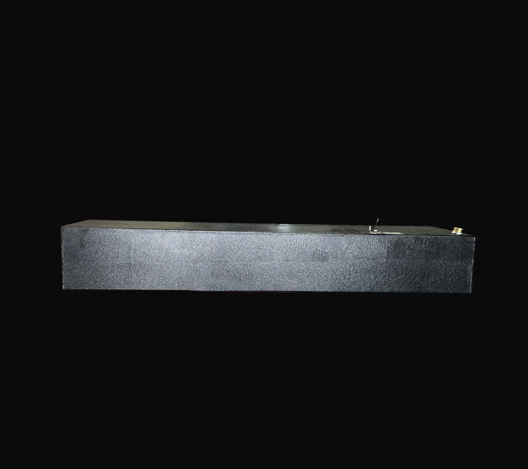 A long, side-profile view of a Sonic 31 replacement fuel tank finished in a protective black Coal Tar Epoxy coating. This heavy-duty marine-grade .190" aluminum tank is precision-fabricated to OEM specifications, featuring top-mounted fuel fittings and an integrated sending unit. Engineered for high-performance offshore vessels, this tank provides superior corrosion resistance and a guaranteed 100% drop-in fit.