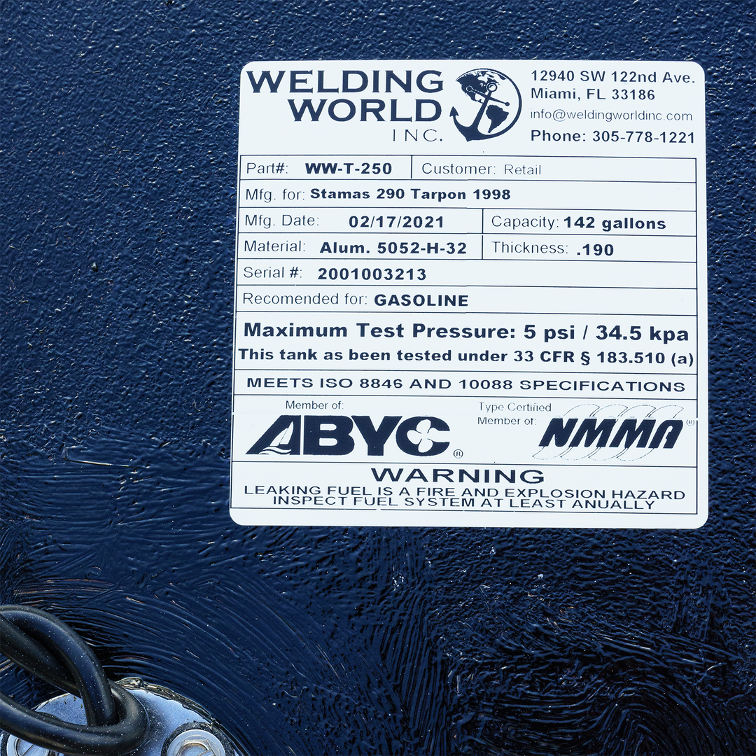 A white product label for a fuel tank from Welding World Inc., displaying specifications for a Stamas 290 Tarpon 1998, including its 142-gallon capacity, material, manufacturing date, and safety certifications