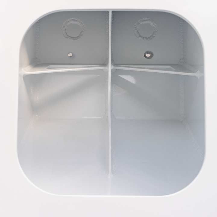 A close-up view of a Standard Apex Single Engine 16° Transom Bracket, featuring a smooth, white interior with two compartments separated by a vertical divider, each with a circular hole at the top