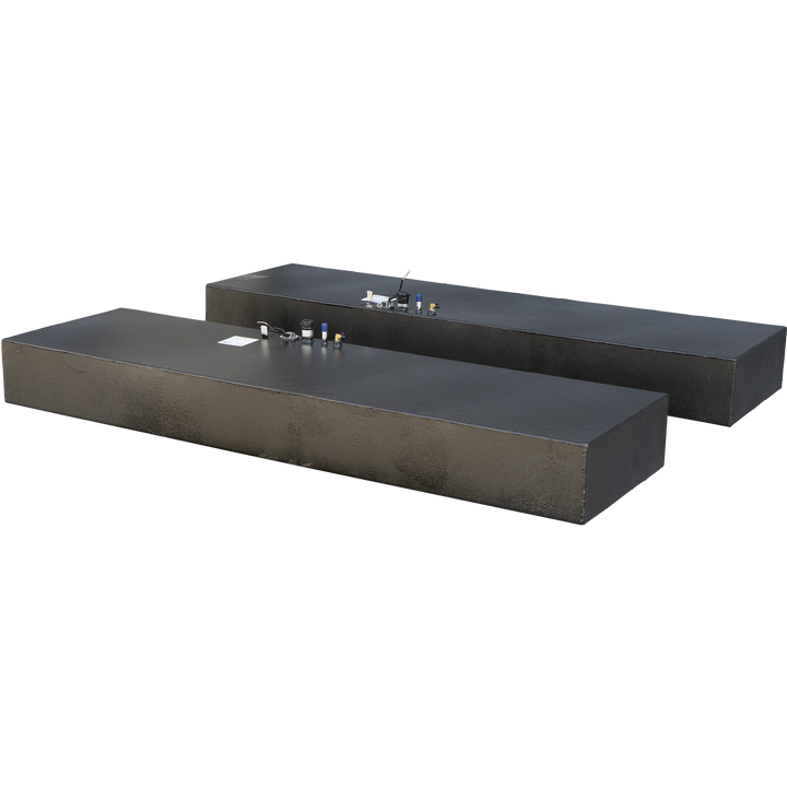 Two dark, textured, rectangular fuel tanks, each with various marine fittings on their top surface, including cylindrical vents with blue caps, brass-colored connectors, and sensors. The tanks are part of a Twin Vee 260 Plastic to Aluminum Conversion Saddle Fuel Tank Combo Kit, each holding 75 gallons net