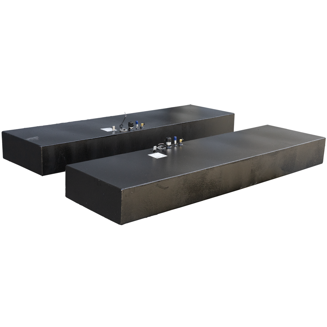 Two long, rectangular fuel tanks with a dark, textured finish, each equipped with multiple fittings on their top surfaces, including blue-capped vents, brass-colored ports, and a central circular access point with wires. These tanks are part of a Twin Vee 260 Plastic to Aluminum Conversion Saddle Fuel Tank Combo Kit, designed to replace existing plastic tanks