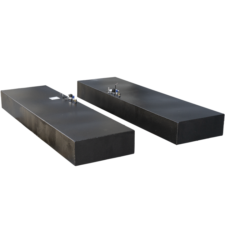 Two identical rectangular fuel tanks, each with a textured black finish, are shown against a checkered background. These are part of a Twin Vee 260 Plastic to Aluminum Conversion Saddle Fuel Tank Combo Kit, with each tank having a 75-gallon net capacity. Both tanks feature various fittings and connections on their top surfaces, including brass components, sensors with wires, and blue-capped vents