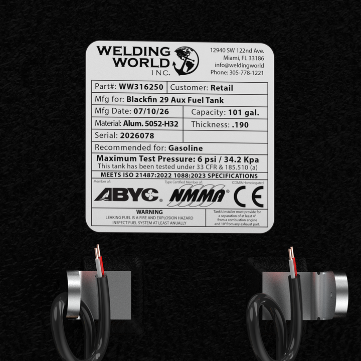 A close-up overhead rendering focusing on the official manufacturer specification placard, dual electronic fuel level sending units, and fuel pickup connections on a black Blackfin 29 Auxiliary OEM replacement marine fuel tank from file image_a869bb.jpg, isolated against a black background. The white weather-resistant data plate highlights precision engineering by Welding World Inc. in Miami, FL, explicitly listing Part Number WW316250, a 101-gallon capacity, heavy-gauge marine-grade 5052-H32 aluminum mater