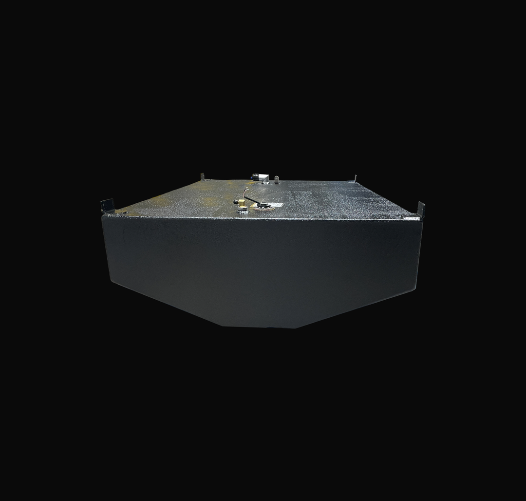 A studio low-angle end view looking along the length of a physical, finished black encapsulated WellCraft 23.8 CCF 1994 OEM replacement marine fuel tank (137 gal) from file image_5c8184.jpg, isolated against a black background. Precision-fabricated from heavy-gauge marine-grade 5052-H32 aluminum, the V-hull contoured body is fully encapsulated in a protective, textured black TarGard epoxy coating to resist severe saltwater pitting and bilge moisture decay. Top deck hardware configuration features welded cor