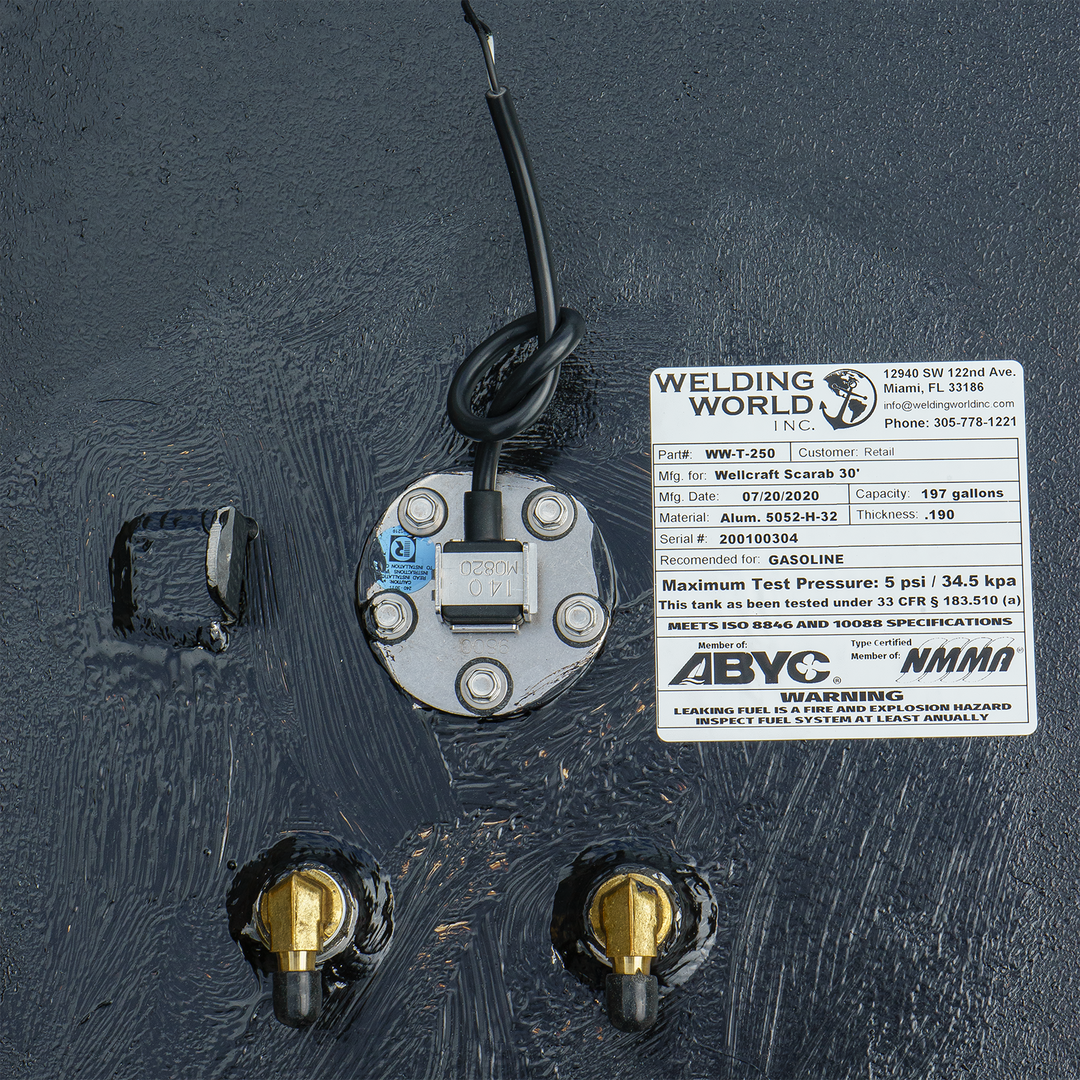 OEM replacement fuel tank for a 30-foot Wellcraft Scarab boat, featuring a 197-gallon capacity. The tank includes a fuel sender unit and two brass fittings, with a label detailing specifications and warnings