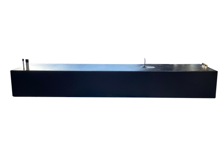A long side profile photo of a dark, textured boat fuel tank, showing various fittings on its top surface, against a transparent checkerboard background.